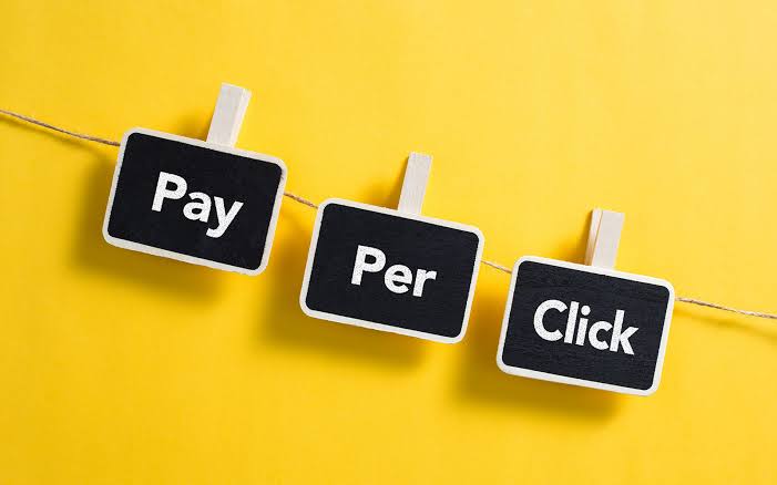Pay Per Click visual with hanging Pay Per Click signs
